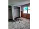 Bedroom with a closet, featuring unfinished walls and flooring, ready for a personalized renovation at 7240 Donna Dr, New Port Richey, FL 34652