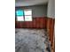 Bedroom showcasing a large window and exposed framing, presenting an opportunity for custom design at 7240 Donna Dr, New Port Richey, FL 34652