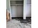 Two separate closets with shelving in a bedroom with incomplete walls and floors awaiting transformation at 7240 Donna Dr, New Port Richey, FL 34652