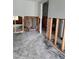 View of a room with partially framed walls, ready to be renovated into a personalized living area at 7240 Donna Dr, New Port Richey, FL 34652