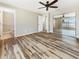 Spacious bedroom features hardwood floors and a closet, as well as an ensuite bathroom at 18019 Avonsdale Cir, Port Charlotte, FL 33948