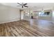 Spacious, open floor plan featuring new hardwood flooring and neutral paint, ready for personal touches at 18019 Avonsdale Cir, Port Charlotte, FL 33948