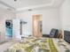 Tranquil bedroom with comfortable seating, ample natural light, and a calming decor style at 5144 Flowing Oar Rd, Wimauma, FL 33598