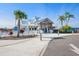 Community clubhouse featuring coastal design and lush landscaping at 5144 Flowing Oar Rd, Wimauma, FL 33598