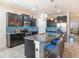 Stylish kitchen with granite countertops, stainless steel appliances, and bar seating, perfect for cooking at 5144 Flowing Oar Rd, Wimauma, FL 33598
