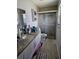 Bathroom featuring granite countertop vanity, walk-in shower, and neutral tile flooring at 119 Caddy Rd, Rotonda West, FL 33947