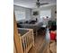 Cozy bedroom with ceiling fan, two windows and wood-look flooring at 119 Caddy Rd, Rotonda West, FL 33947