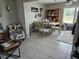 Bright dining room with tile flooring, table with seating for six, and wooden hutch at 119 Caddy Rd, Rotonda West, FL 33947