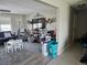 This living room features a rug, television, decor, and doorway to the entryway at 119 Caddy Rd, Rotonda West, FL 33947
