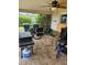 Cozy screened-in patio furnished with a grill and table offering a relaxing outdoor space at 119 Caddy Rd, Rotonda West, FL 33947