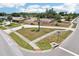 Aerial view of a single-Gathering home showcasing landscaping, driveway, and proximity to neighborhood amenities at 1301 Lucaya Ave, Venice, FL 34285