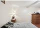 Bedroom featuring laminate wood floors and warm light from a bedside table lamp at 1301 Lucaya Ave, Venice, FL 34285
