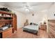 Bedroom featuring laminate wood floors, ceiling fan, and lots of storage at 1301 Lucaya Ave, Venice, FL 34285