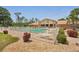 Community clubhouse and pool with ample seating and well-maintained landscaping at 1301 Lucaya Ave, Venice, FL 34285