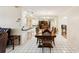 A formal dining room features tile floors with a large table and seating for six at 1301 Lucaya Ave, Venice, FL 34285