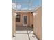 Outdoor entrance featuring a glass door, overhead lattice, and globe-shaped lights at 1301 Lucaya Ave, Venice, FL 34285