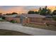 Home featuring a screened enclosure, well-kept exterior, and concrete driveway at 1301 Lucaya Ave, Venice, FL 34285