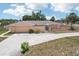 Aerial view of a single-Gathering home showcasing landscaping, driveway, and attached screened in porch at 1301 Lucaya Ave, Venice, FL 34285