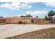 Single-story home featuring an attached two-car garage and an enclosed back porch at 1301 Lucaya Ave, Venice, FL 34285