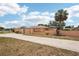 A view of the exterior featuring an attached garage and enclosed back porch at 1301 Lucaya Ave, Venice, FL 34285