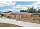 Aerial view of a one-story house with a two-car garage and an enclosed back porch at 1301 Lucaya Ave, Venice, FL 34285