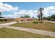 Lovely single-story home with a well-maintained front yard and a long driveway at 1301 Lucaya Ave, Venice, FL 34285