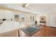 Bright living room with bar, two sets of glass doors, and tile flooring at 1301 Lucaya Ave, Venice, FL 34285