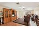 Open-concept living area with hardwood floors and classic furnishings at 1301 Lucaya Ave, Venice, FL 34285