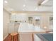 Entertainer's living room with bar, ceiling fan and access to the backyard at 1301 Lucaya Ave, Venice, FL 34285