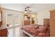 Inviting main bedroom with ceiling fan, outdoor access and ensuite bathroom at 1301 Lucaya Ave, Venice, FL 34285