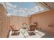 Patio featuring overhead lattice, seating, and a glass-topped table at 1301 Lucaya Ave, Venice, FL 34285