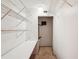 Walk-in closet with white wire shelving, a built-in desk, and carpet flooring at 1301 Lucaya Ave, Venice, FL 34285