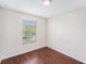 Bright bedroom showcasing a window and hardwood floors at 14174 Oakham St, Tampa, FL 33626