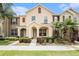 Charming townhome featuring manicured landscaping and a welcoming covered entrance at 14174 Oakham St, Tampa, FL 33626