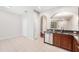 Bright kitchen featuring stainless steel appliances, granite countertops, and stylish cabinetry at 14174 Oakham St, Tampa, FL 33626