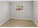 Small bedroom featuring tile flooring and natural light; create your cozy retreat at 2824 Oaklawn Ave, Largo, FL 33771