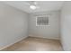 Bedroom with tile flooring, ceiling fan, and neutral walls; natural light from window at 2824 Oaklawn Ave, Largo, FL 33771