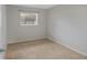 Neutral bedroom with tile floors and window; features light walls at 2824 Oaklawn Ave, Largo, FL 33771