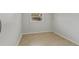 Small bedroom with tile flooring, and a window; perfect for relaxation at 2824 Oaklawn Ave, Largo, FL 33771