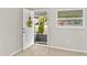 Bright entryway featuring neutral walls, tile flooring, and a white front door with a decorative wreath at 2824 Oaklawn Ave, Largo, FL 33771