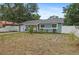 Charming single-story home with a blue exterior, well-maintained landscaping, and an attached garage at 2824 Oaklawn Ave, Largo, FL 33771