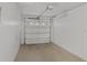 Spacious single-car garage with white walls and a roll-up door to the exterior at 2824 Oaklawn Ave, Largo, FL 33771