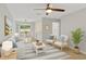 Bright living room featuring stylish furnishings and a seamless connection to the dining area at 2824 Oaklawn Ave, Largo, FL 33771