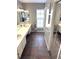 Spacious bathroom with double sinks and a large mirror over granite countertops at 3628 Nettle Creek Ct, Holiday, FL 34691