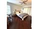 Bright bedroom features hardwood floors, vaulted ceilings, and a modern ceiling fan at 3628 Nettle Creek Ct, Holiday, FL 34691