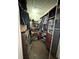 Walk-in closet provides ample storage with shelves and hanging space for clothes and shoes at 3628 Nettle Creek Ct, Holiday, FL 34691