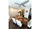Light-filled dining room with ceiling fan, adjacent to the kitchen, perfect for Gathering meals at 3628 Nettle Creek Ct, Holiday, FL 34691