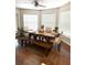 Dining room featuring a large table with bench seating and lots of natural light at 3628 Nettle Creek Ct, Holiday, FL 34691