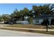 Charming home features a manicured lawn and white vinyl fence, enhancing its curb appeal at 3628 Nettle Creek Ct, Holiday, FL 34691