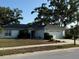 Charming single-story home featuring a well-maintained lawn and mature landscaping at 3628 Nettle Creek Ct, Holiday, FL 34691